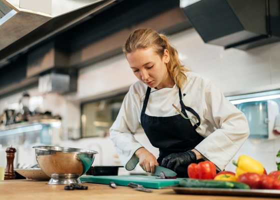 female-chef-chopping-vegetables-kitchen_23-2148763134.jpg