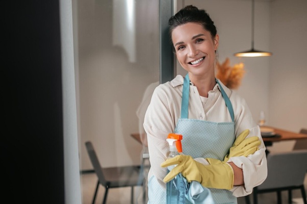 domestic-routine-smiling-housewife-apron-standing-kitchen_259150-59700.jpg