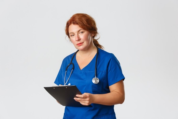 redhead-middle-aged-nurse-posing_1258-35877.jpg