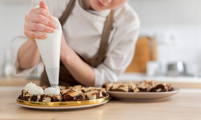 close-up-cook-preparing-dessert_23-2148972039.jpg