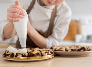 close-up-cook-preparing-dessert_23-2148972039.jpg