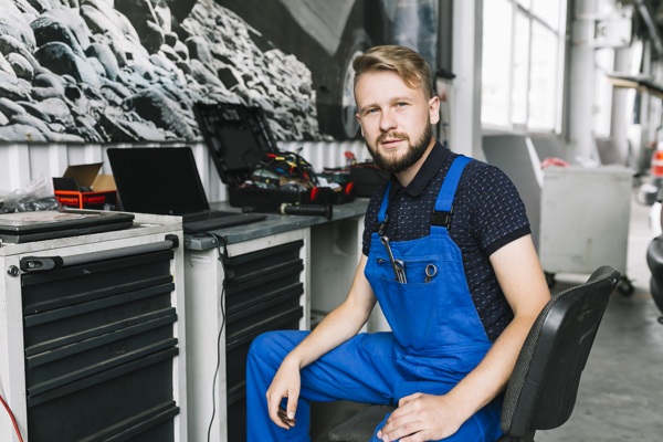 technician-sitting-workbench.jpg