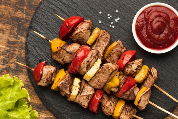 top-view-delicious-kebab-slate-with-salad-ketchup_23-2148685527.jpg