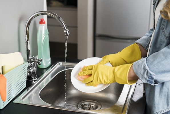 side-view-woman-washing-plate-sink.jpg