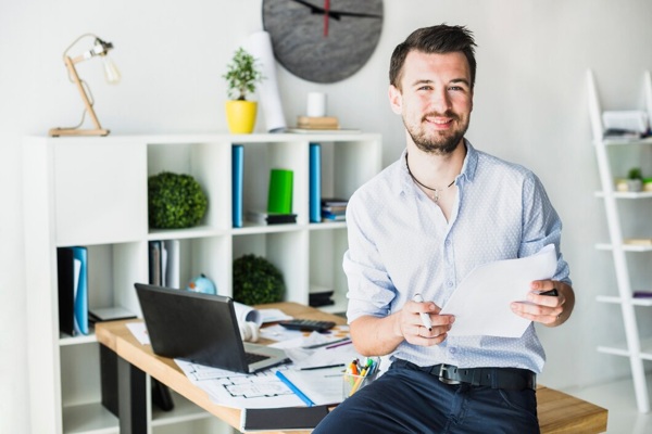 portrait-happy-young-businessman-with-document_23-2147839950.jpg