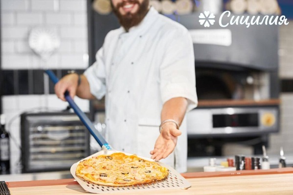 cropped-photo-baker-holding-fresh-baked-pizza-laying-metallic-shovel_651396-860 (2).jpg