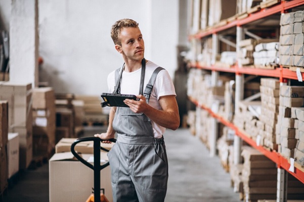 young-man-working-warehouse-with-boxes_1303-16613.jpg