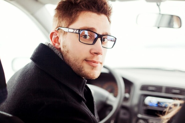 close-up-young-man-with-glasses-sitting-car_1140-333.jpg