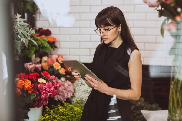 woman-florist-her-own-floral-shop-taking-care-flowers_1303-15619.jpg