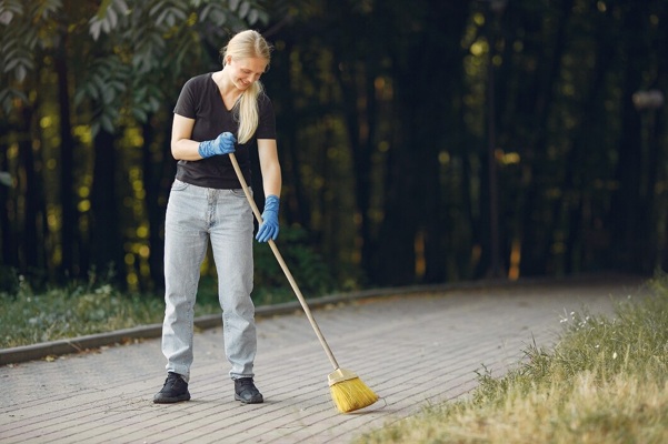 woman-collects-leaves-cleans-park_1157-27413.jpg