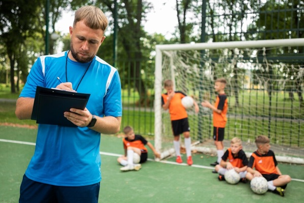 football-trainer-teaching-his-pupils_23-2149707992.jpg