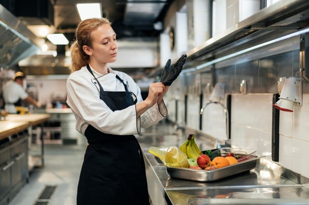 female-chef-putting-glove-kitchen_23-2148763159.jpg