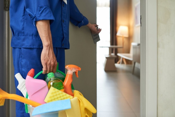 unrecognizable-cleaner-walking-into-hotel-room-with-tools-detergents_1098-17830.jpg