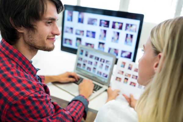 male-female-business-executives-interacting-while-working.jpg