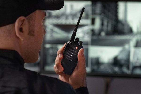 portrait-male-security-guard-with-radio-station-camera-screens_23-2150368715.jpg