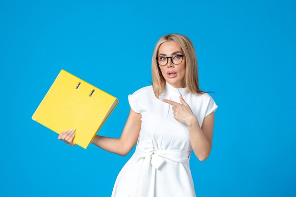 front-view-female-worker-white-dress-holding-yellow-folder-blue-wall_140725-151084.jpg