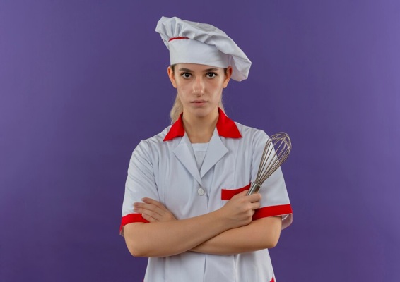 young-pretty-cook-chef-uniform-standing-with-closed-posture-holding-whisk-looking_141793-26423.jpg