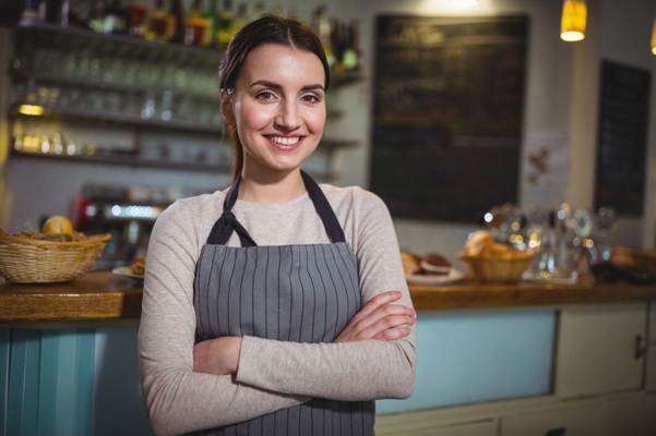 portrait-smiling-waitress-standing-counter_1170-664.jpg