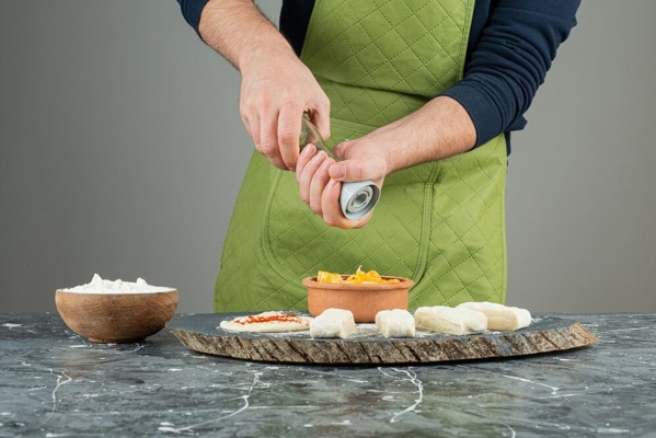 male-hand-gloves-adding-salt-dough-marble-table_2831-7939.jpg