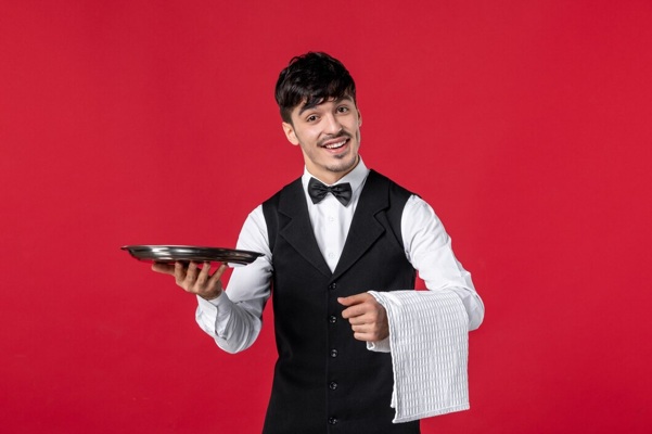 young-male-waiter-uniform-with-butterfly-neck-holding-tray-towel-red-background_140725-146765.jpg