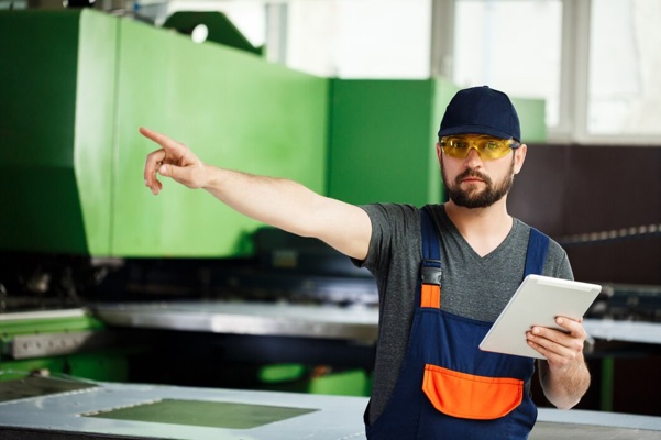 portrait-worker-pointing-finger-side-steel-factory-background_176420-5535.jpg