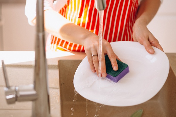 female-hands-washing-doshes-close-up.jpg