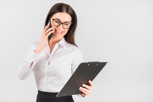 happy-business-woman-with-clipboard-talking-by-phone_23-2148073163.jpg