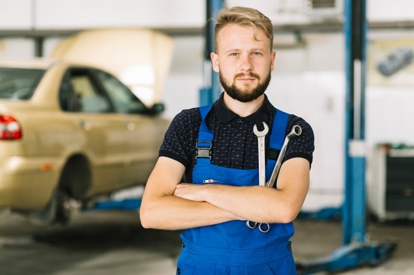 auto-mechanic-crossing-hands-with-spanners_23-2147897804.jpg