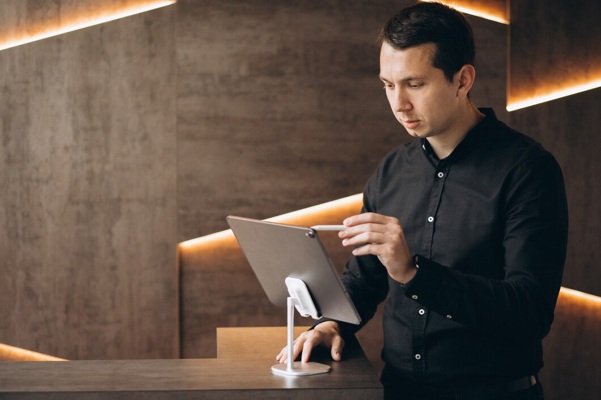 handsome-business-man-working-with-tablet-office_1303-22647.jpg