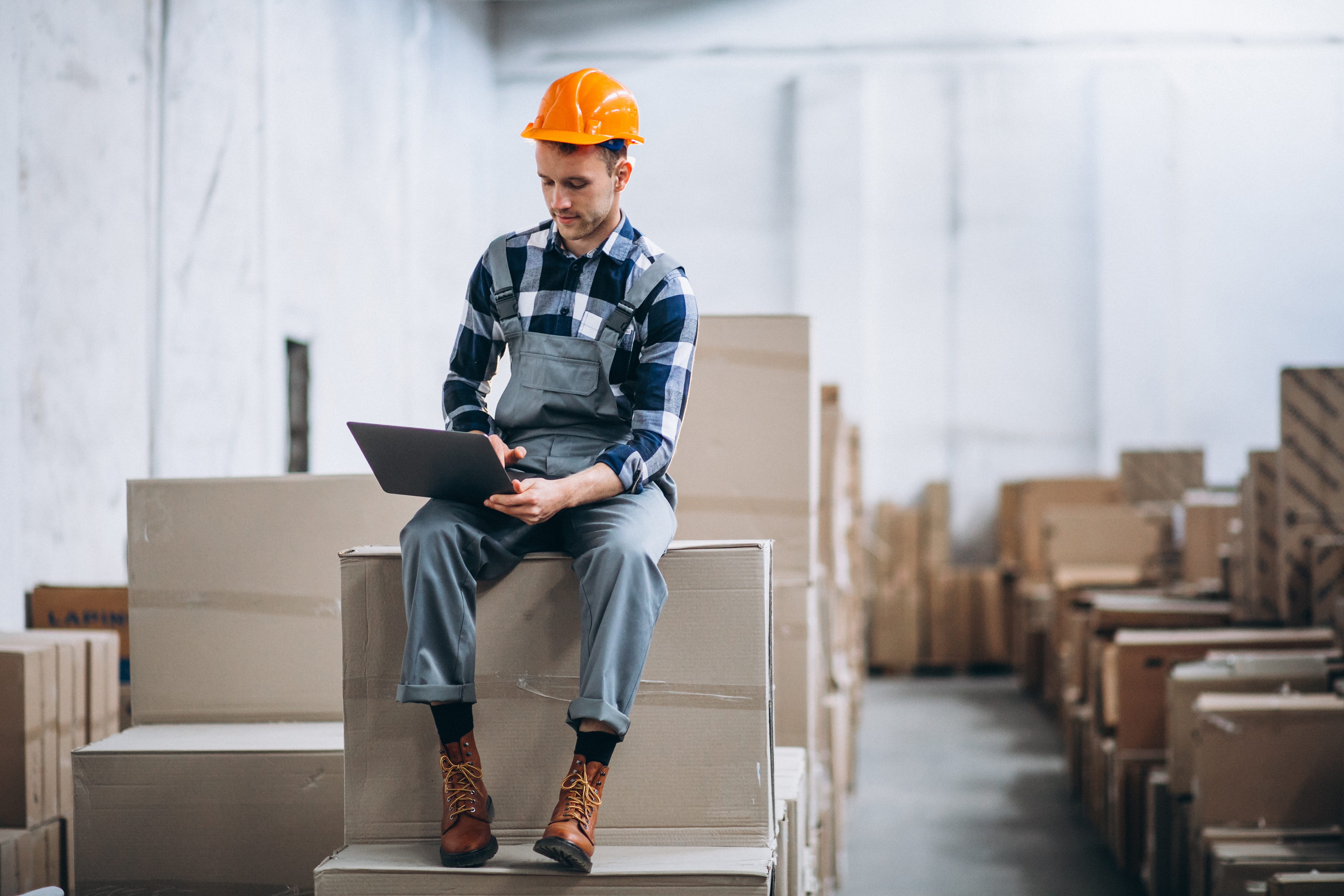 young-man-working-warehouse-with-boxes.jpg