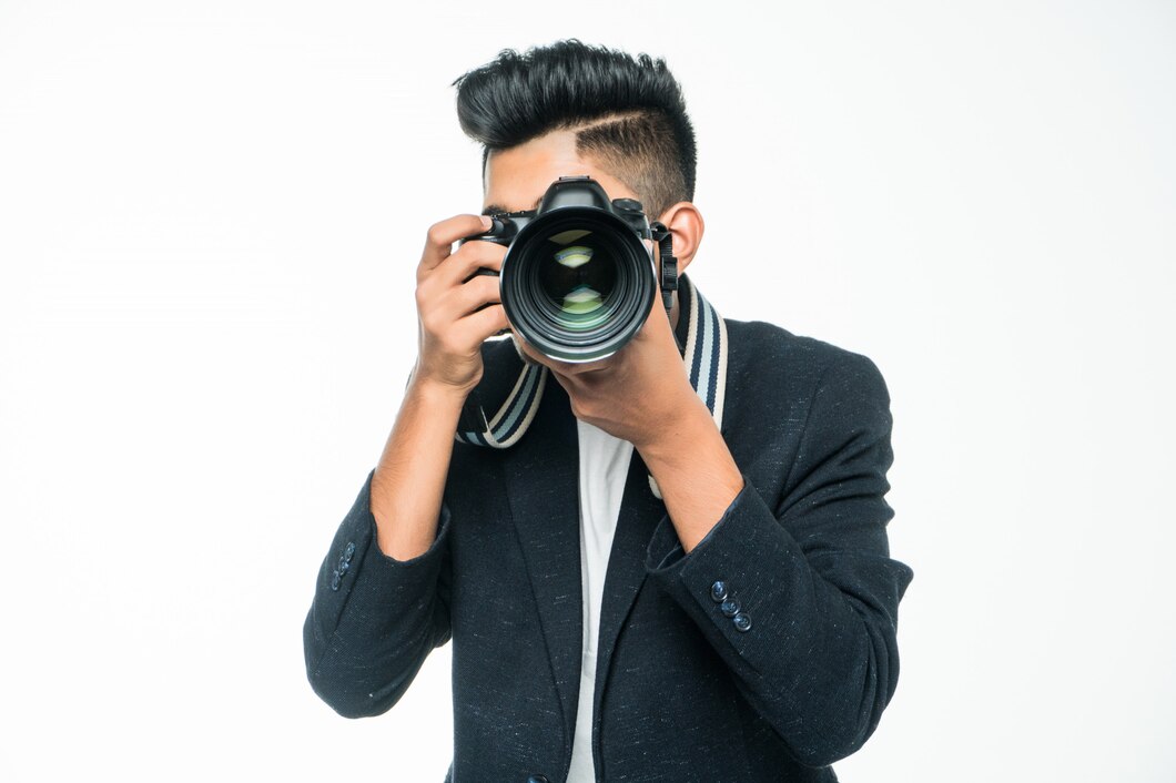 young-asian-man-with-camera-isolated-white-background-photographer-concept_231208-3767.jpg