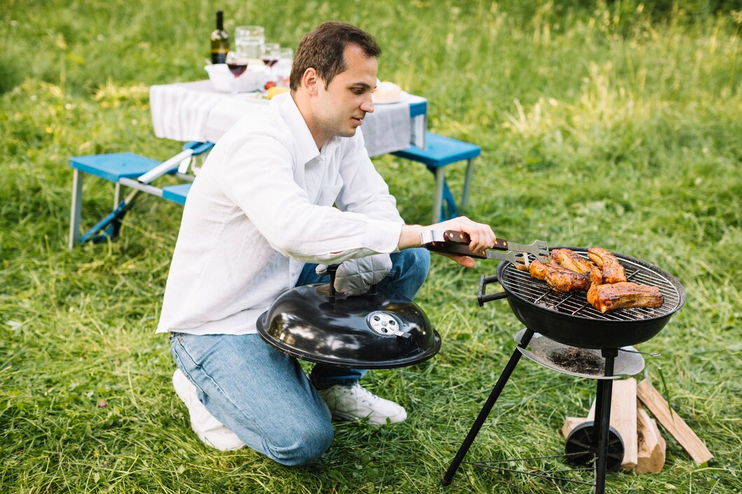 man-with-barbecue-nature_23-2148199451.jpg