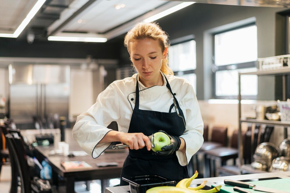 female-chef-removing-apple-skin_23-2148763193.jpg