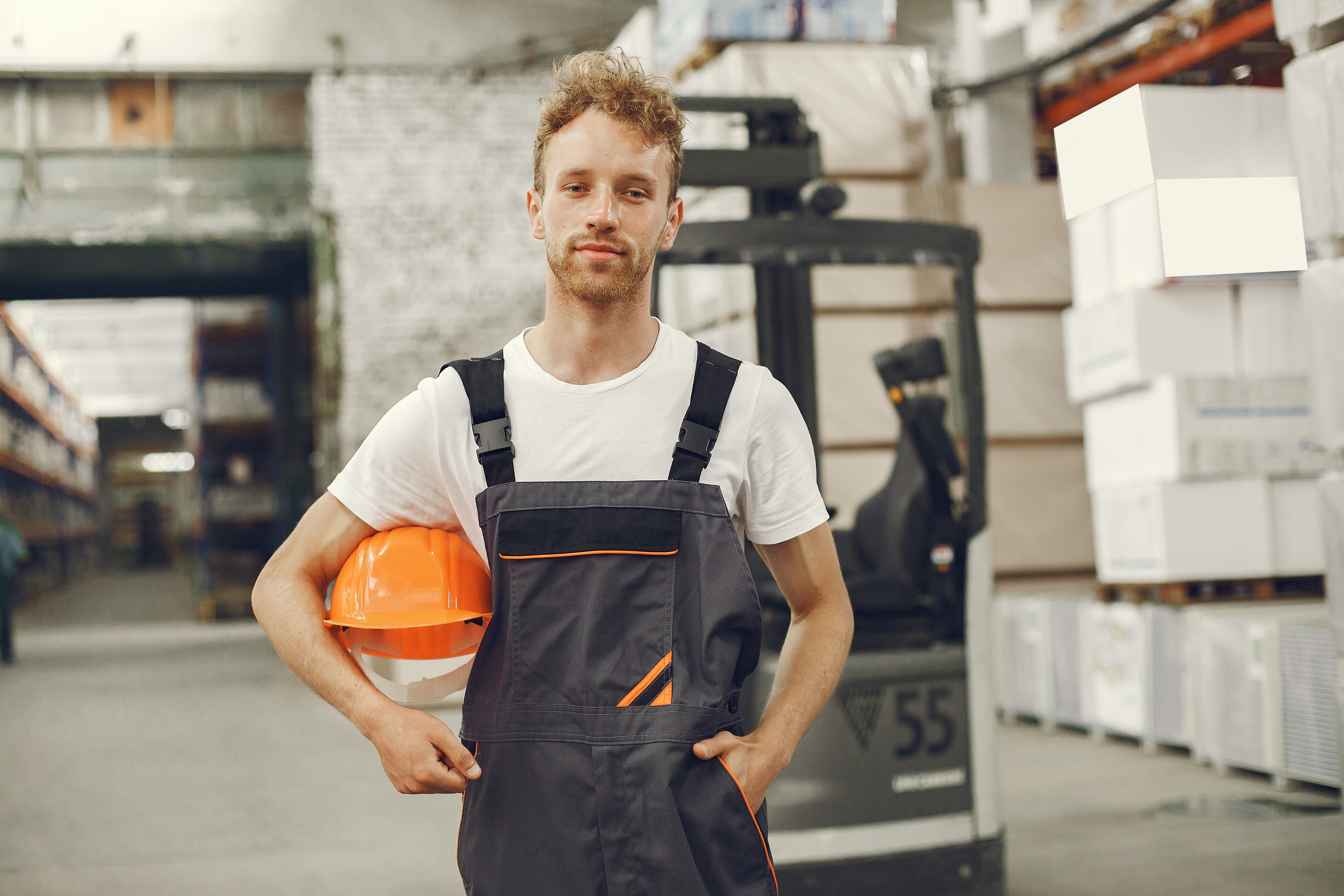 industrial-worker-indoors-factory-young-technician-with-orange-hard-hat.jpg