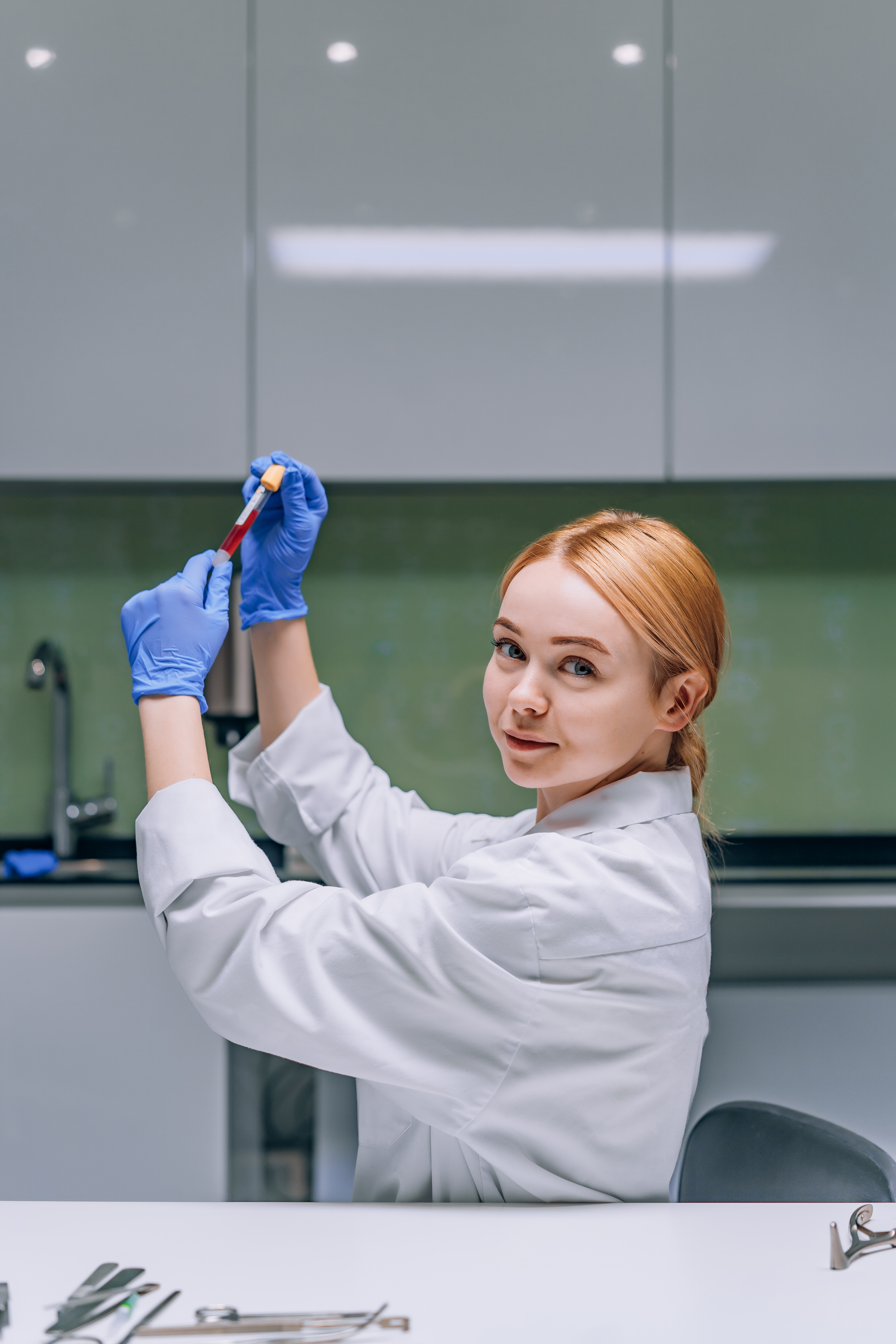 female-medical-scientific-researcher-looking-test-tube-laboratory.jpg