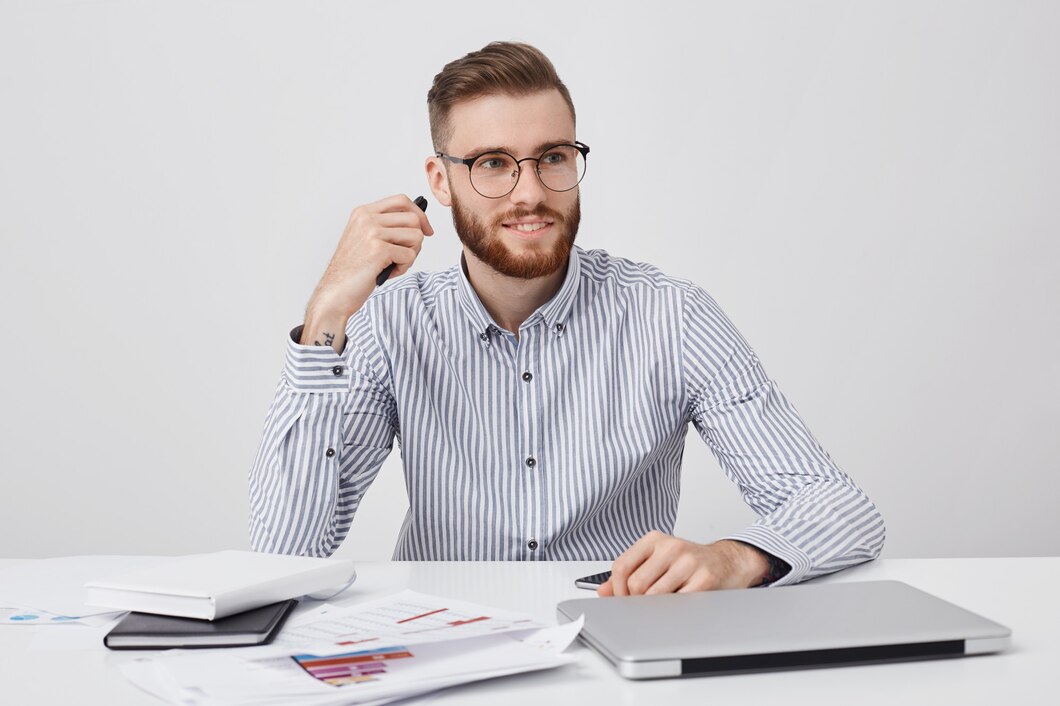 portrait-male-office-worker-has-specific-appearance-dressed-formally-sits-white-desk_273609-8198.jpg