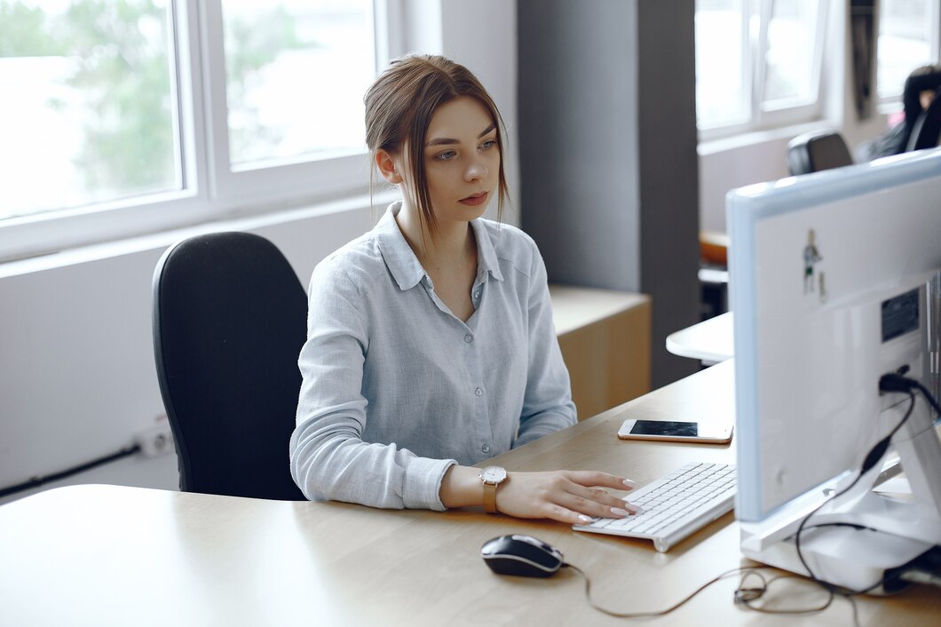 woman-uses-computer-girl-is-sitting-office-lady-uses-keyboard_1157-40471.jpg