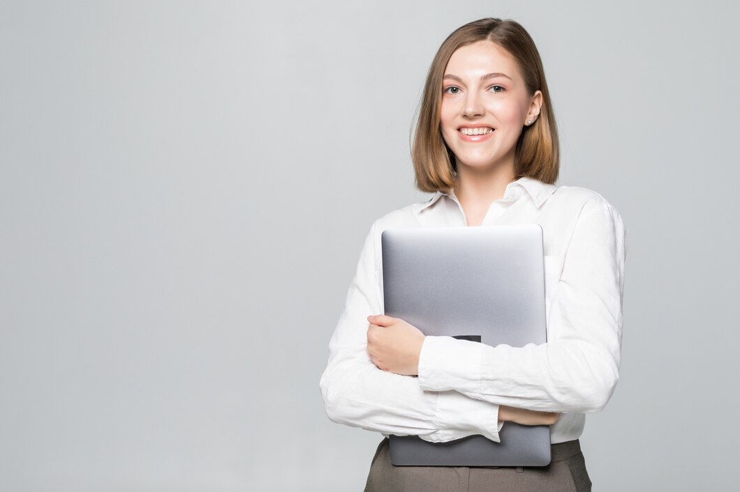 successful-business-woman-holding-laptop-white_231208-10683.jpg