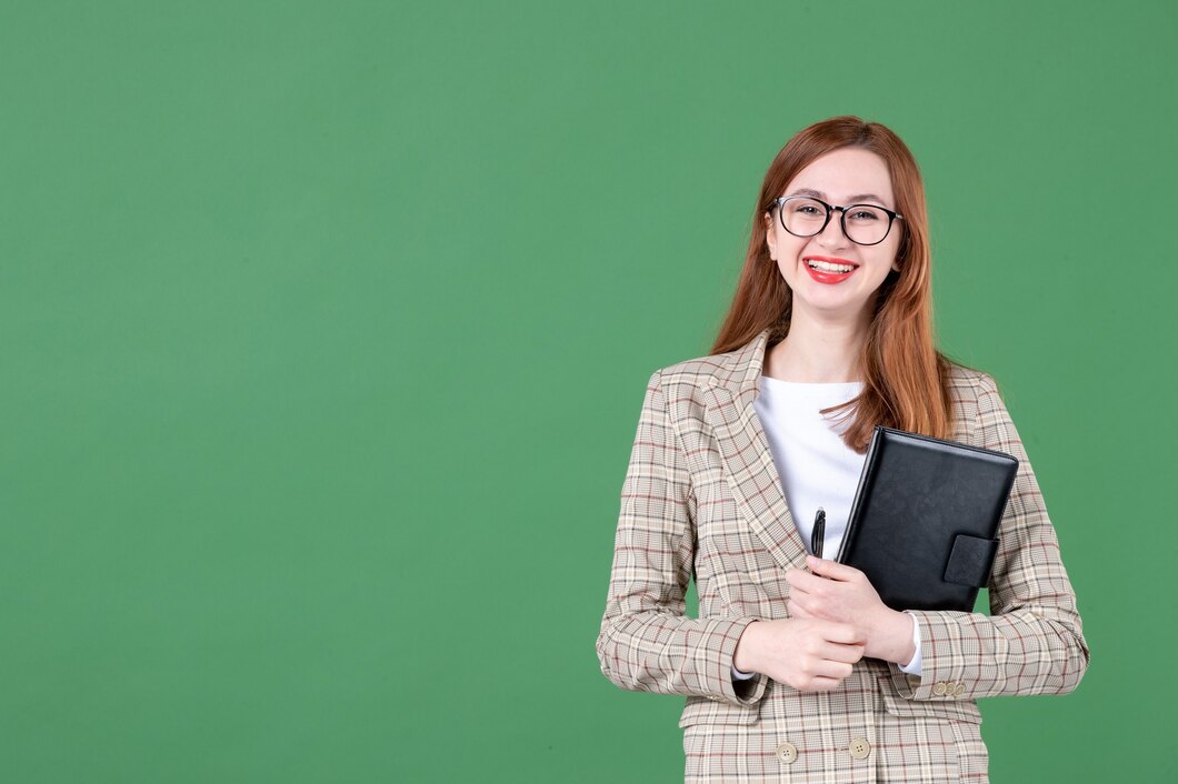 portrait-female-teacher-with-notepad-green_140725-150681.jpg