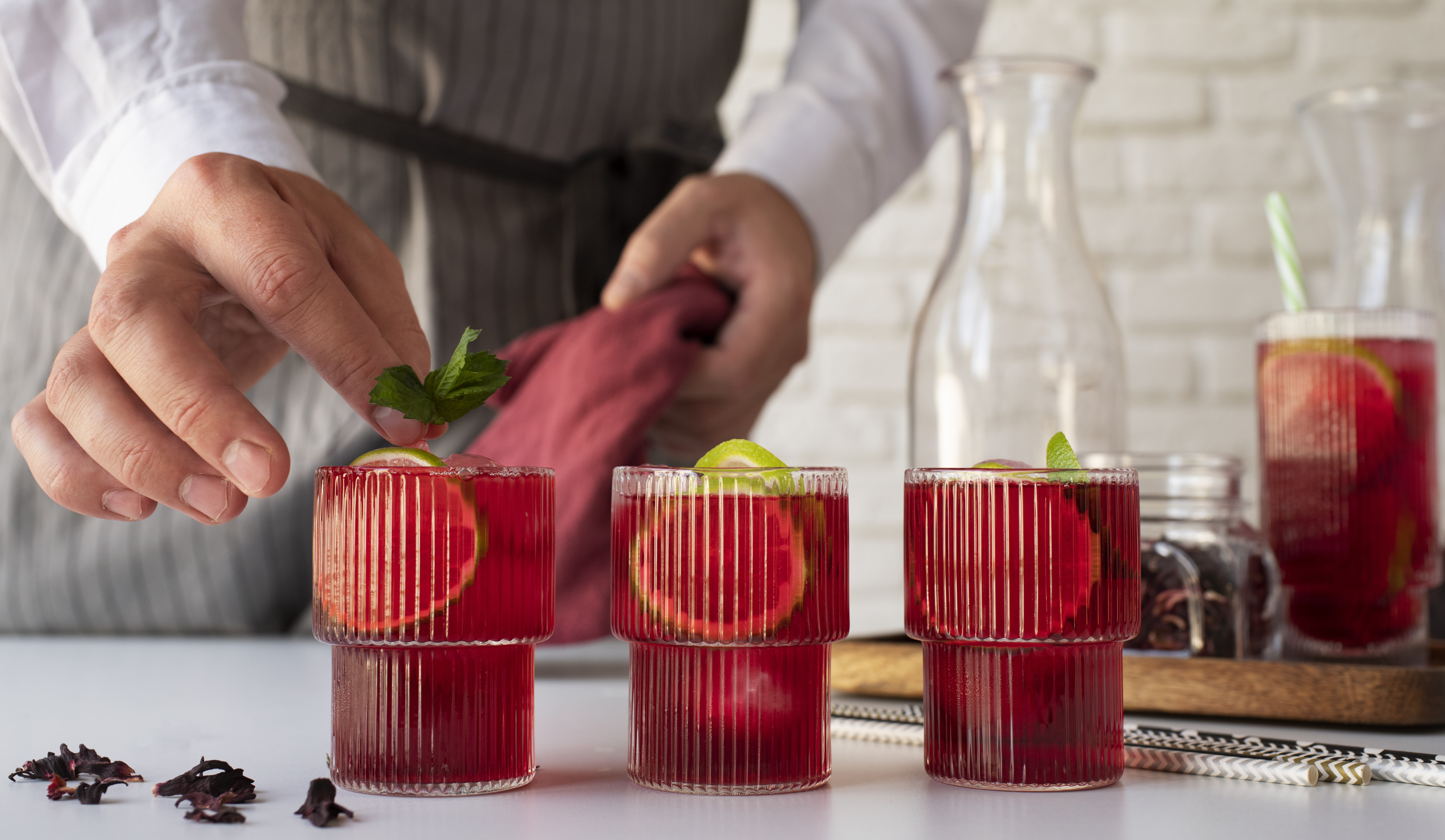 person-making-refreshing-hibiscus-ice-tea.jpg