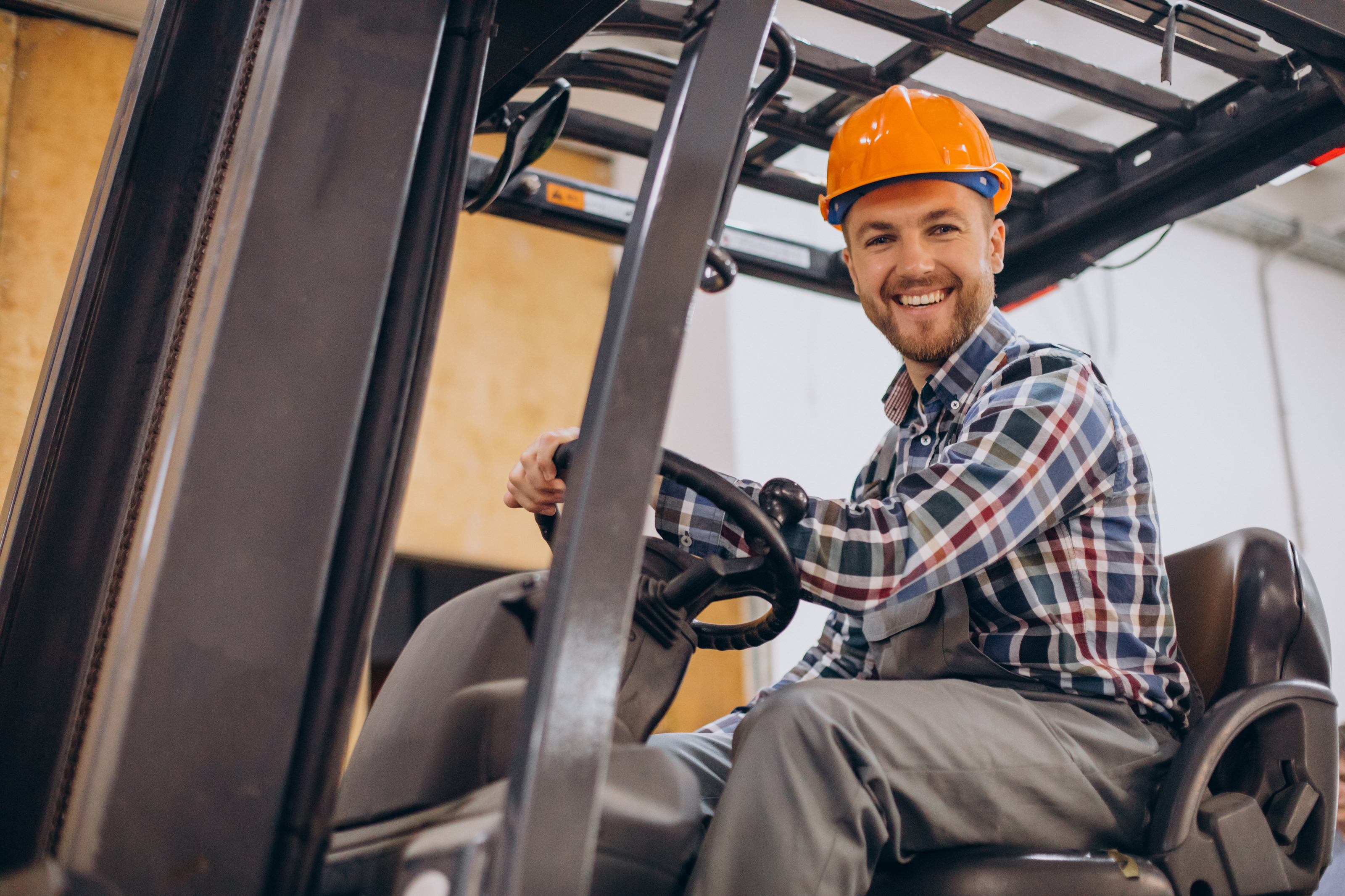 man-working-warehouse-driving-forklift.jpg