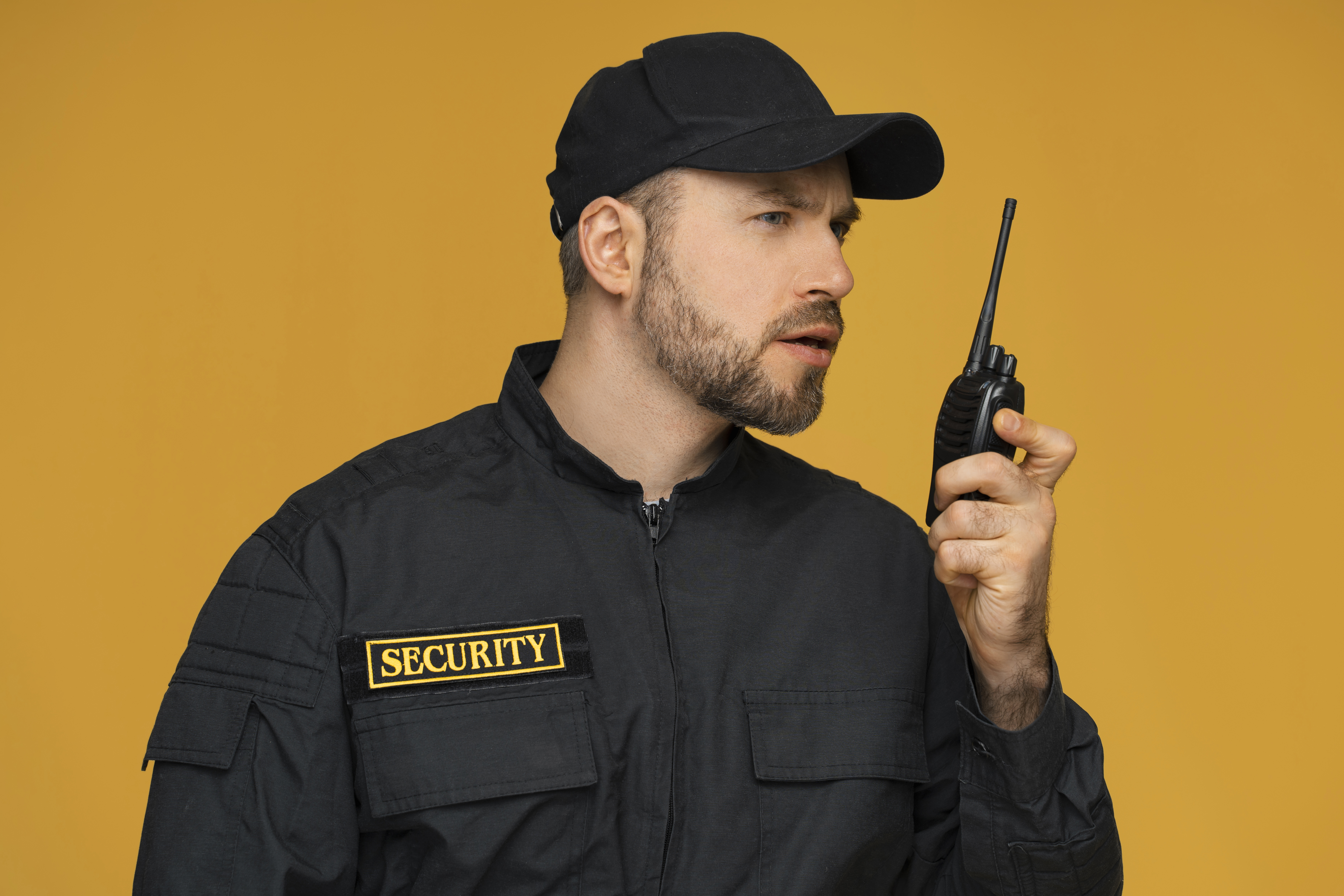 medium-shot-security-officer-posing-studio.jpg