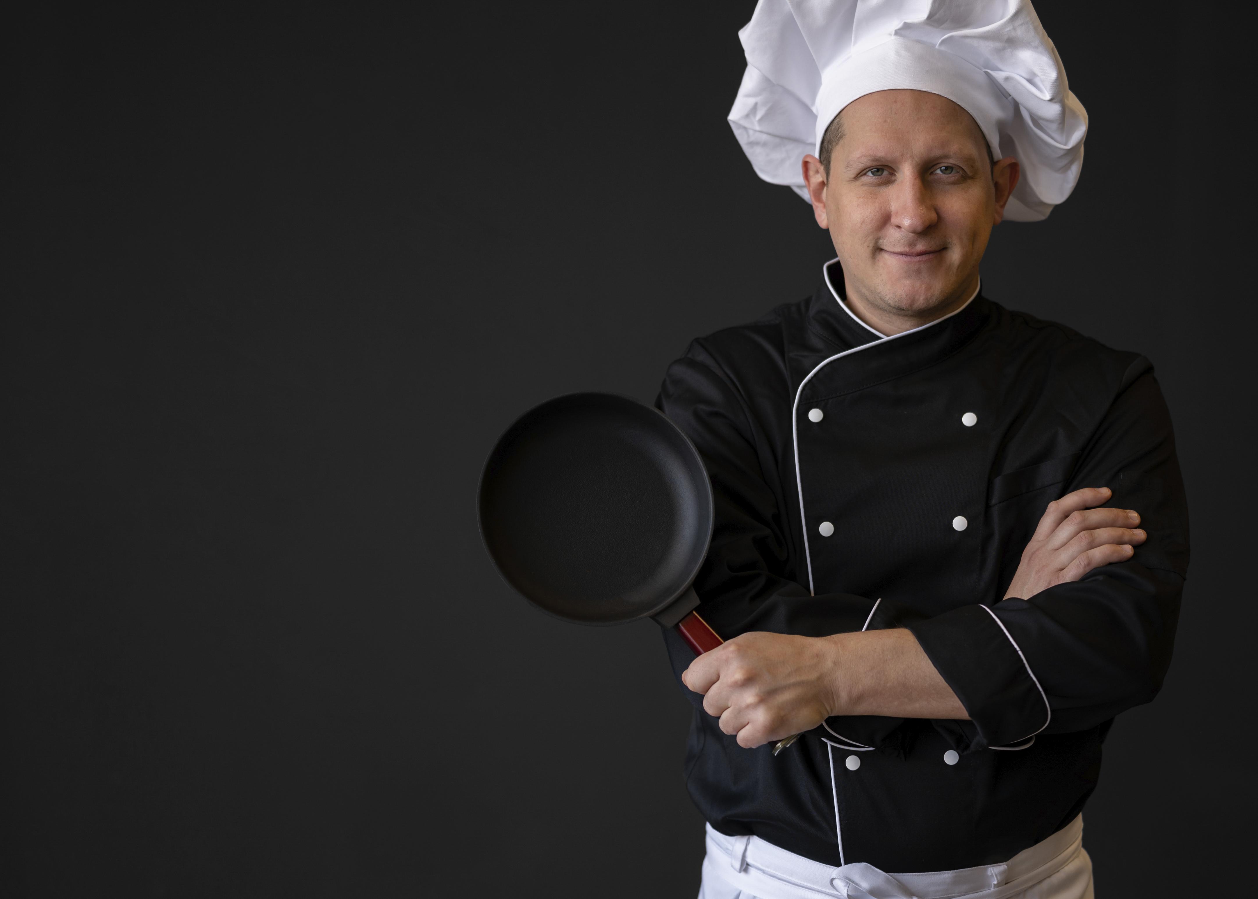 medium-shot-chef-with-pan-posing.jpg