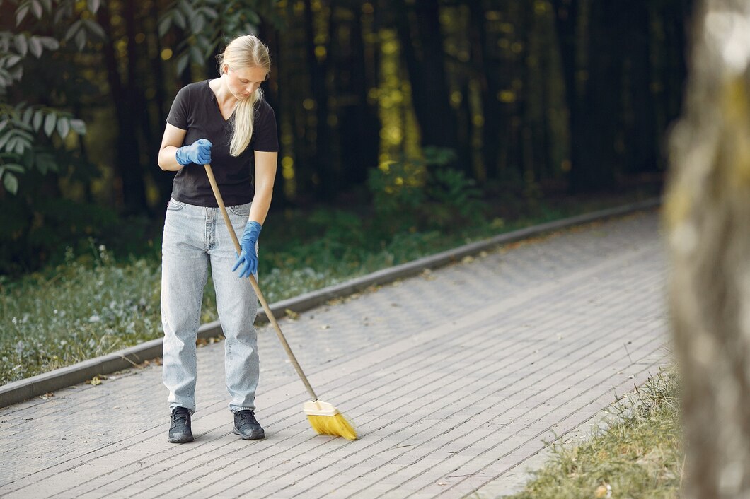 woman-collects-leaves-cleans-park_1157-27412.jpg